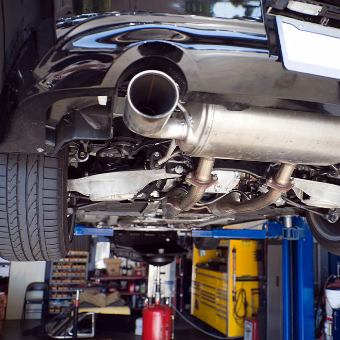 Cars up on lifts in an auto repair shop