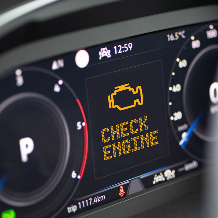 Interior of a modern car and a Check Engine warning light